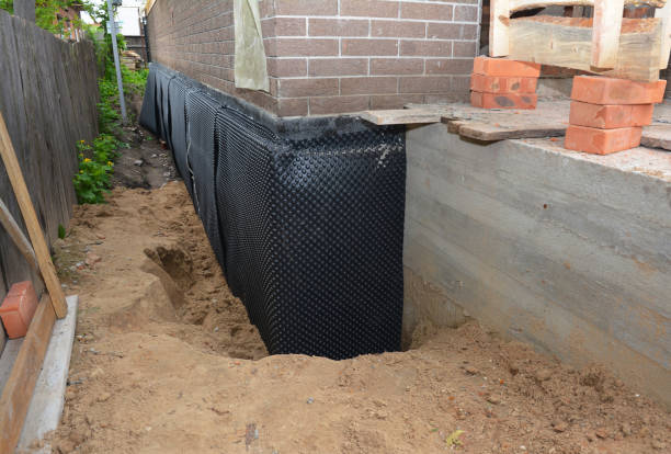 Happy homeowners after waterproofing job in Benton Ridge